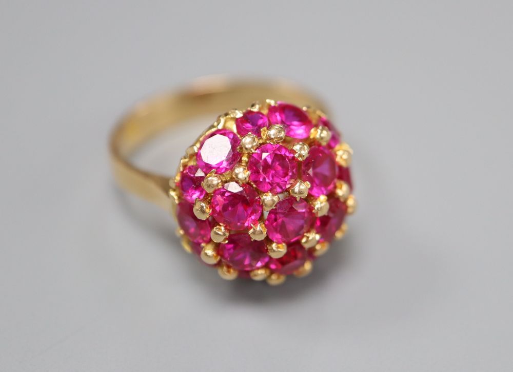 A mid to late 20th century Italian? 750 and synthetic? ruby cluster dress ring, size M/N, gross 8.3 grams.